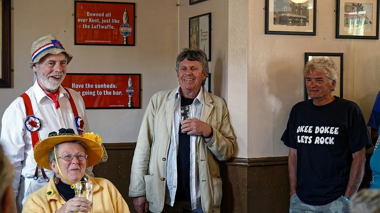 Folk musicians playing fiddles and whistles in a pub