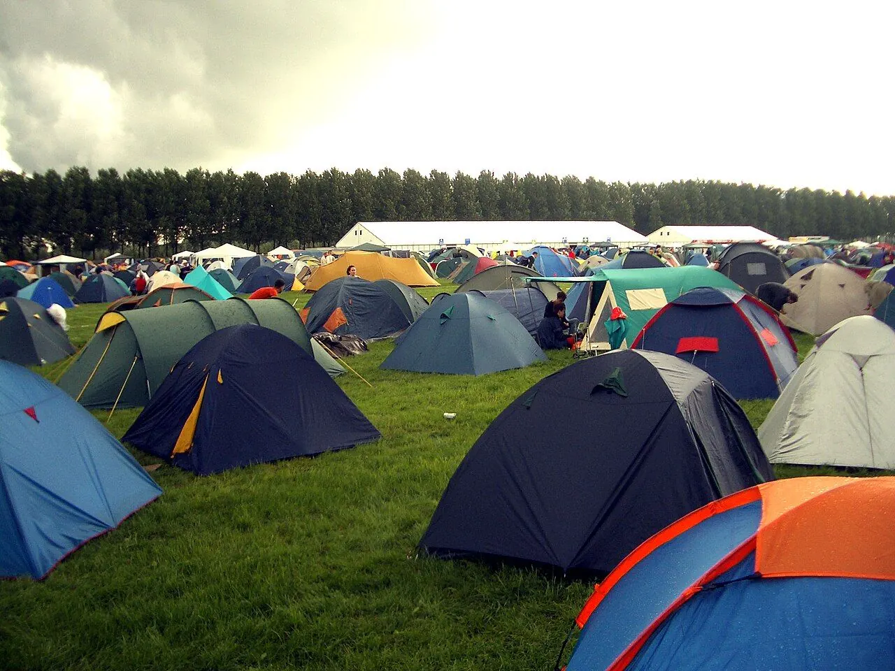 Tent, wellies and rucksack packed for a festival campsite