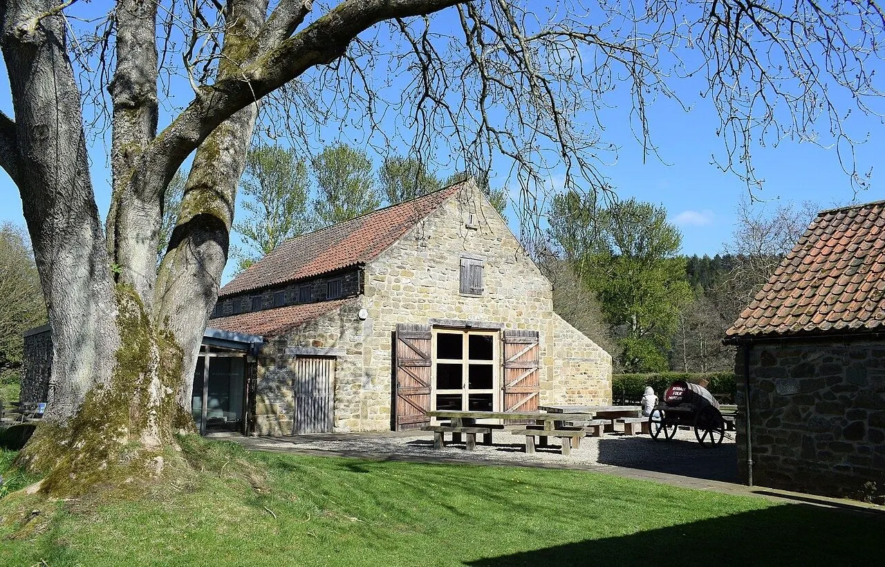 Thatched cruck-framed cottage at an open-air folk museum